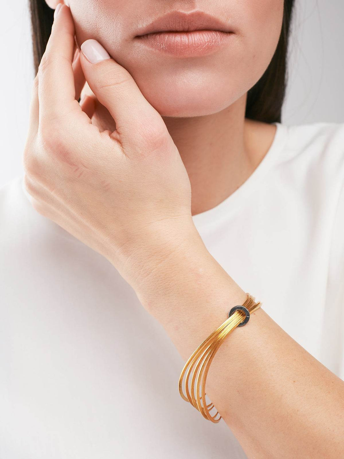 model wearing a Silver Bracelet with a Gold plated finish