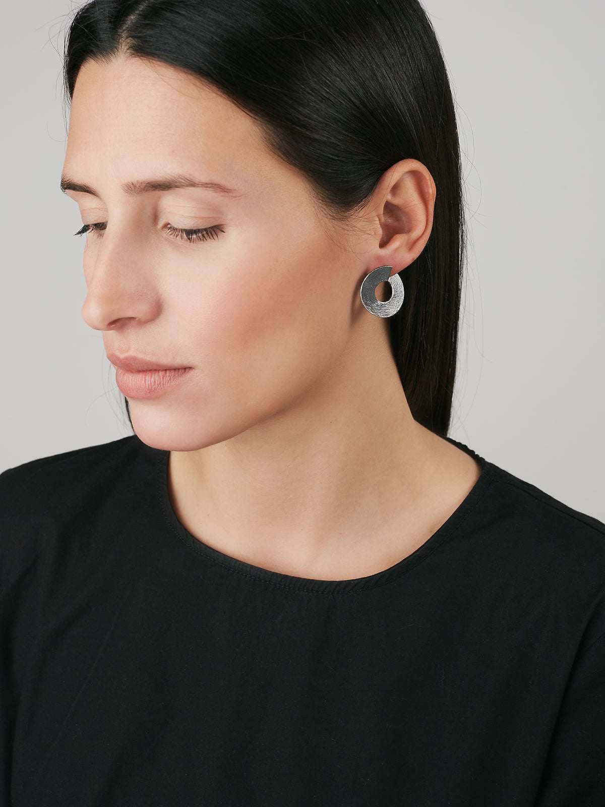 model wearing Silver Earrings with an Oxidized finish