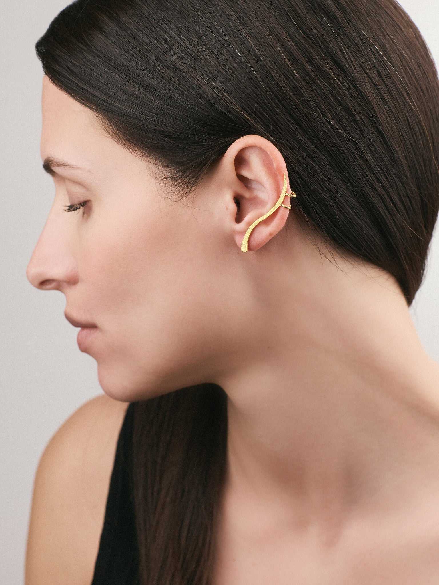 Model wearing Silver Earrings with a Gold plated finish