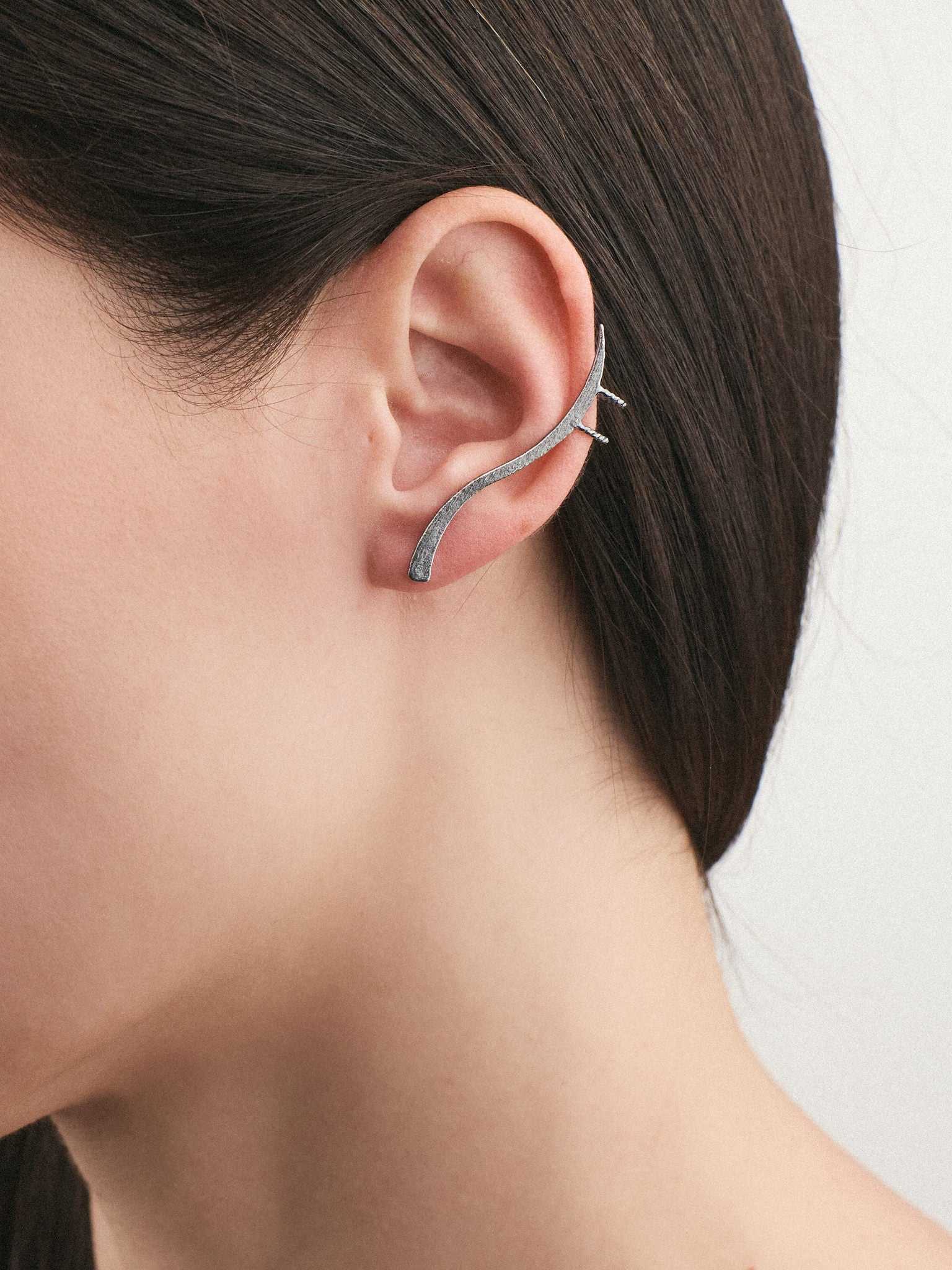 model wearing Silver Earrings with an Oxidized finish