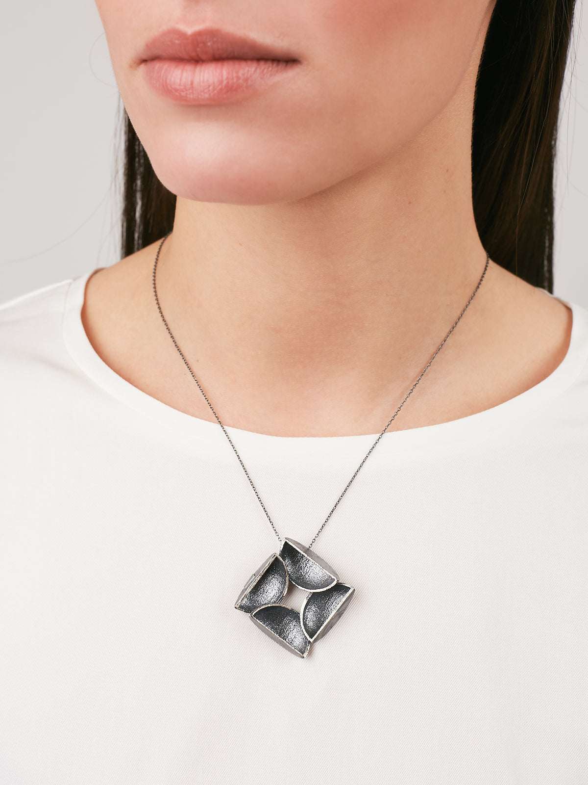 model wearing Silver Necklace with an Oxidized finish