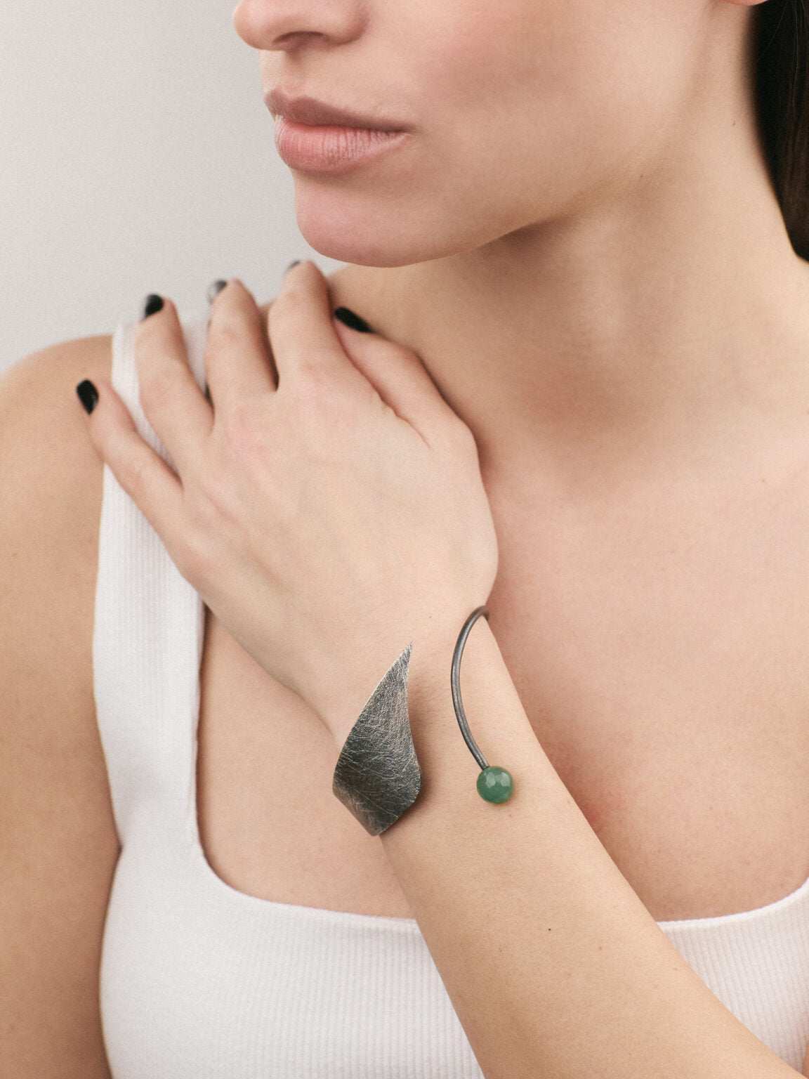 Model wearing a Silver Bracelet with an Oxidized finish and Aventurine gemstone