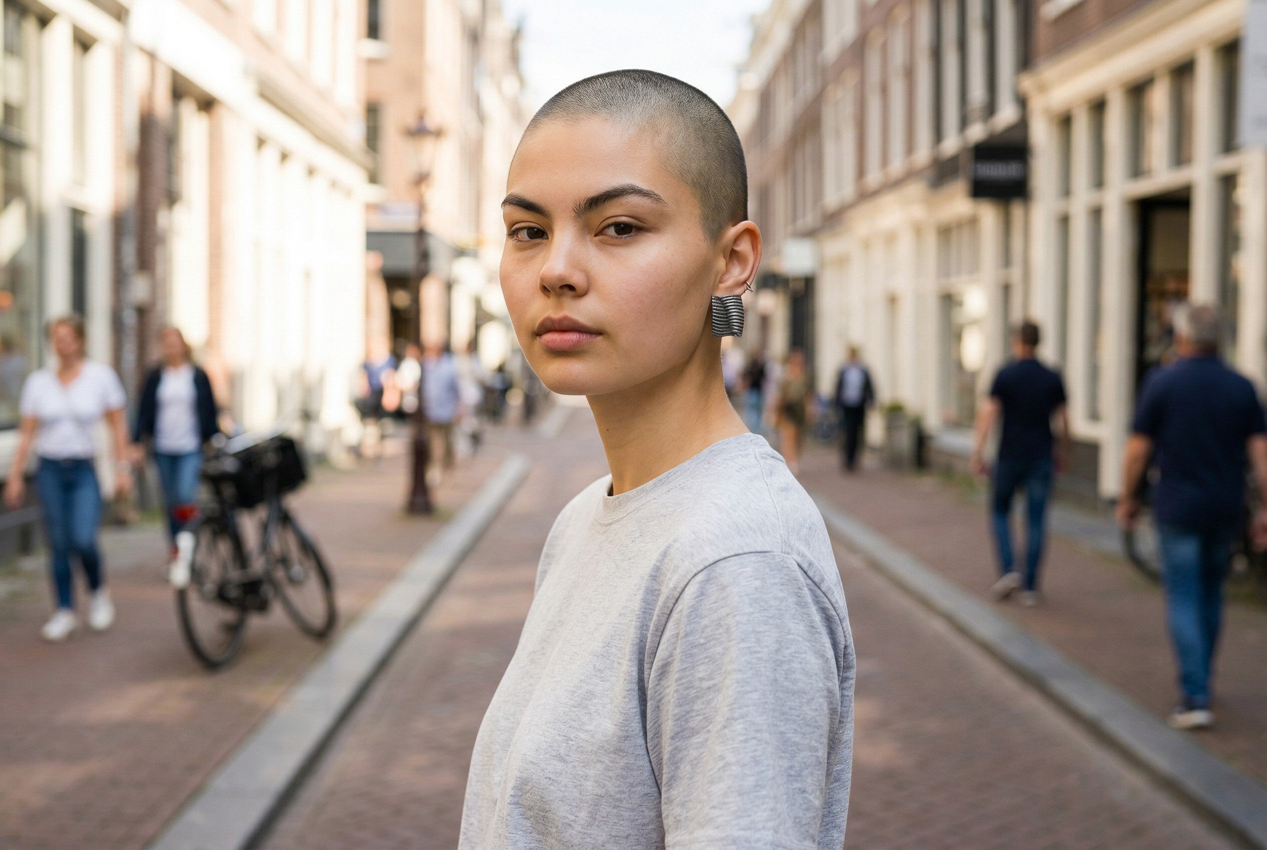 Woman wearing silver earrings from Jouly K