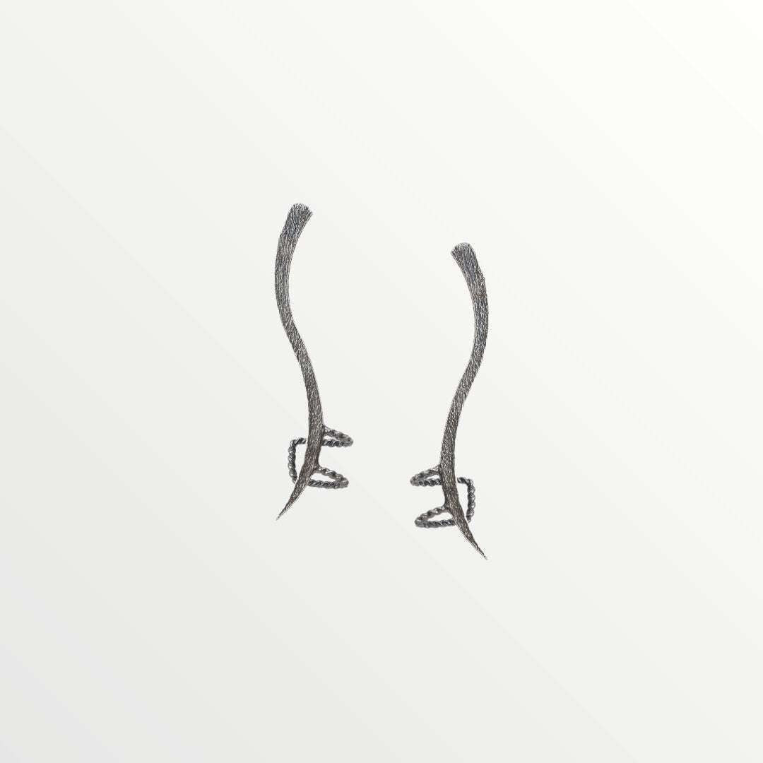 Jouly K abstract silver-toned ear cuff with a flowing, sculptural design for non-pierced ears.
