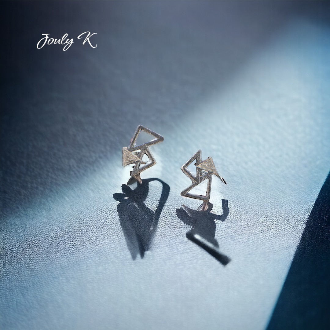 Jouly K abstract geometric triangle earrings with a cool metallic finish, perfect for modern style.