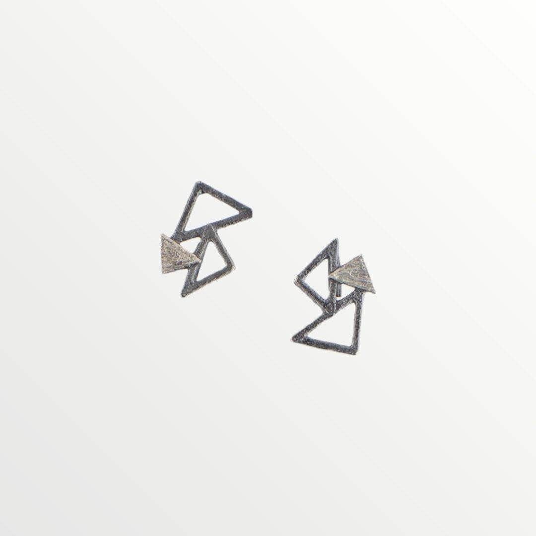 Jouly K abstract geometric triangle earrings with a cool metallic finish and interlocking design.