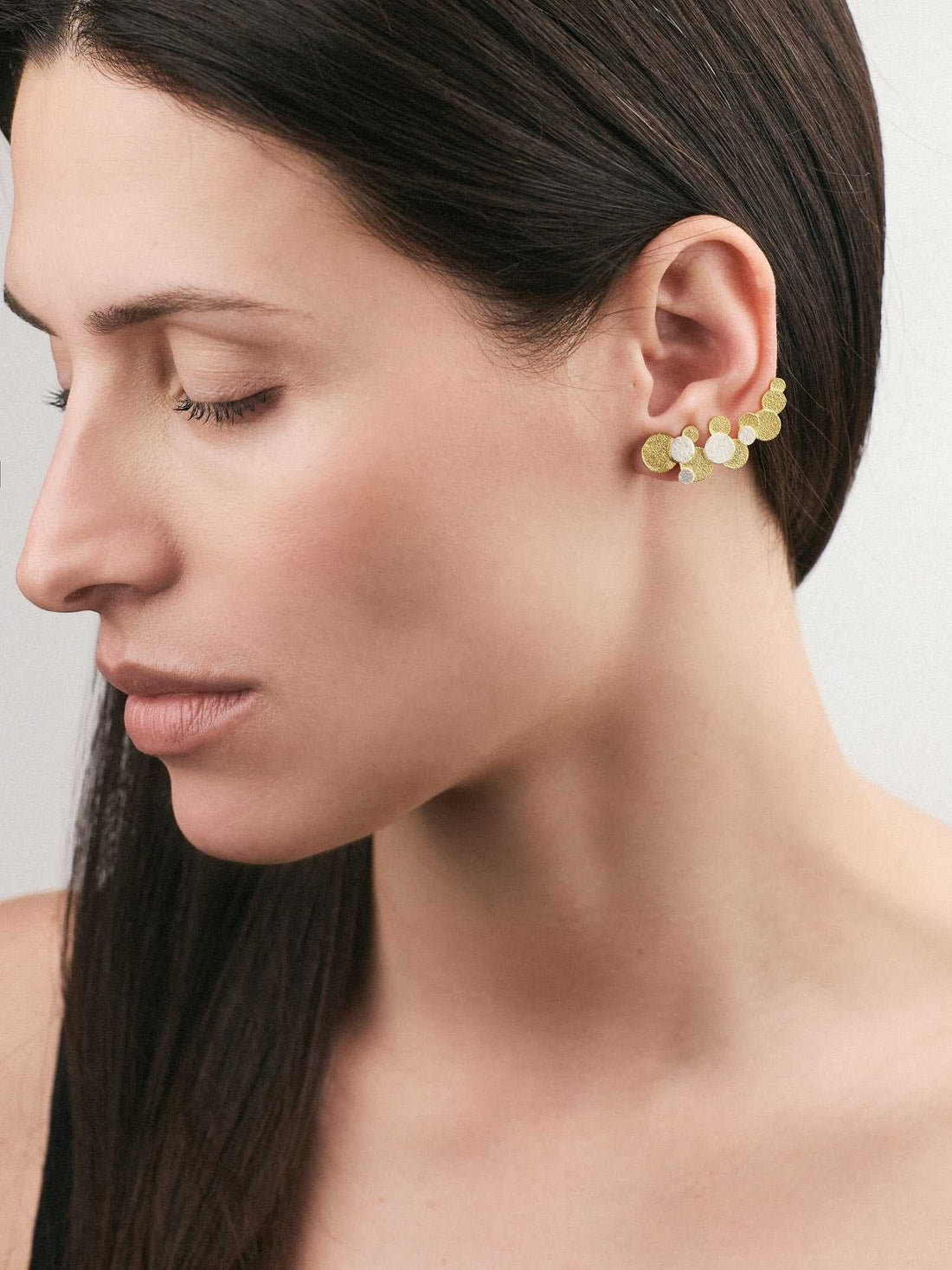 Jouly K handmade silver earrings with 22ct gold plated finish, featuring a cluster of textured circles.