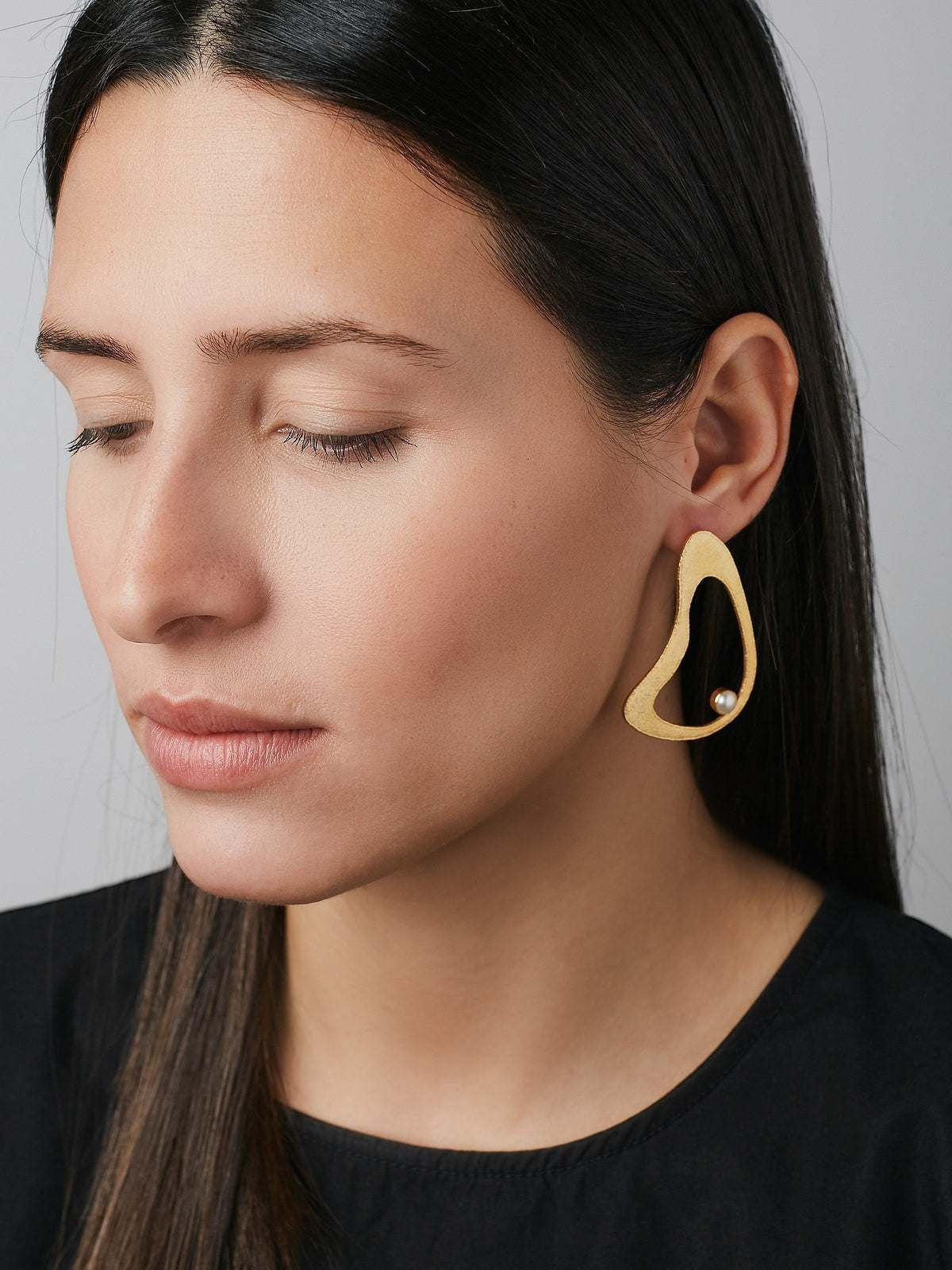 Jouly K handmade gold plated earrings with white pearl accent. Abstract shape, 22ct gold plated silver 925.