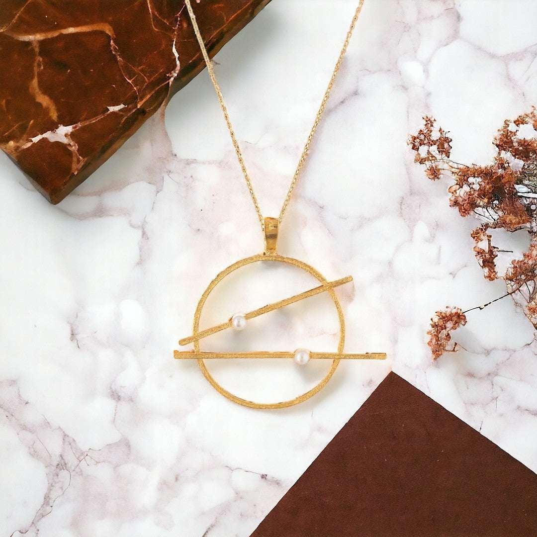 Jouly K handmade gold plated silver necklace with white pearls and a unique geometric design.