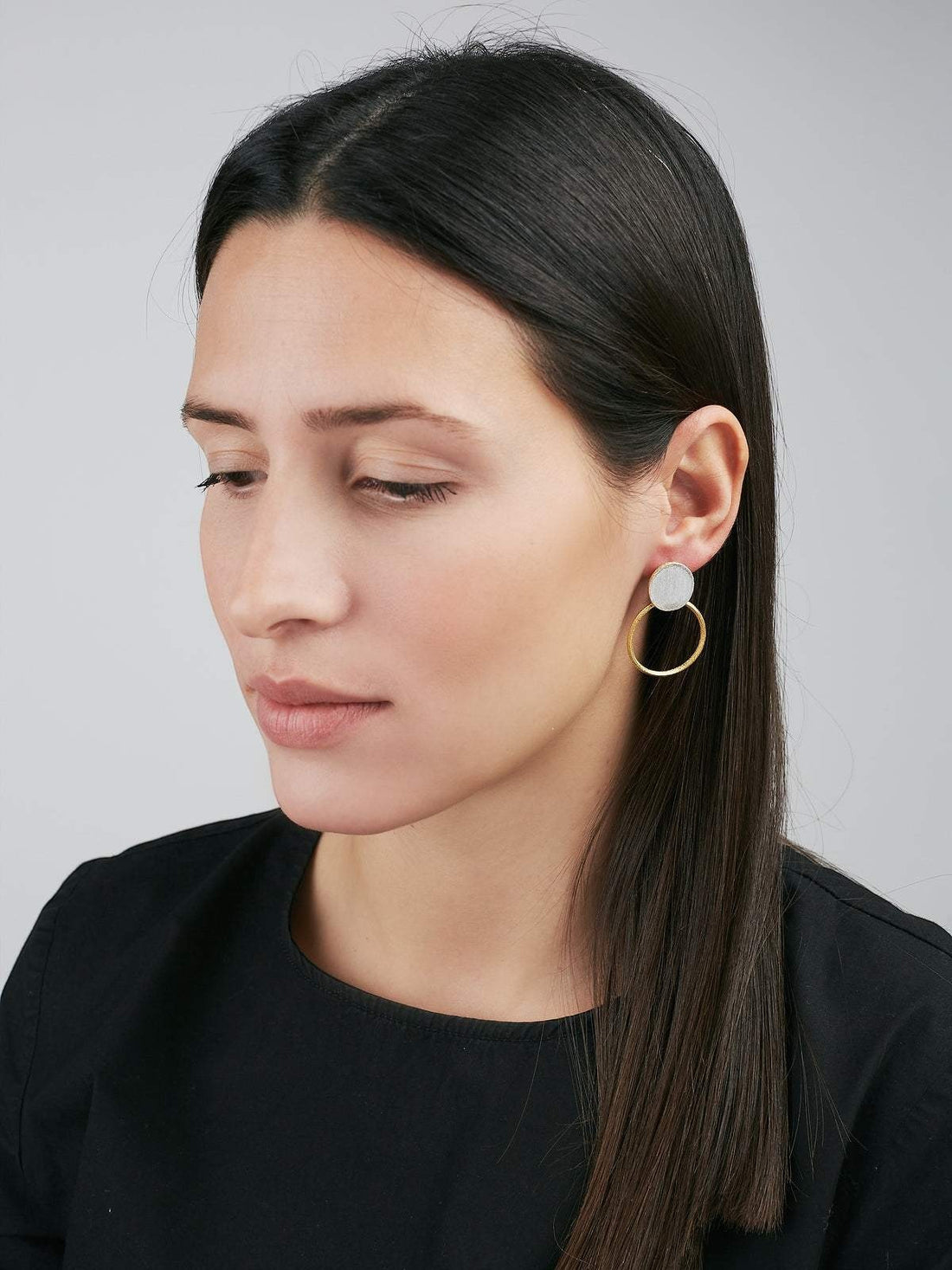Jouly K handmade silver earrings with gold plated finish, featuring a hoop and a circular disc.