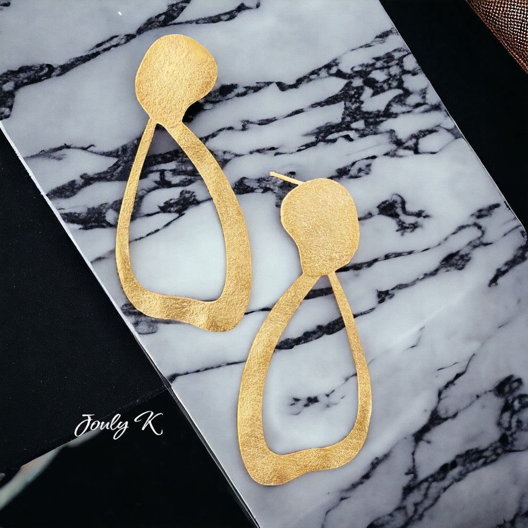 Jouly K handcrafted gold plated silver earrings with a unique abstract teardrop shape. Textured matte finish.