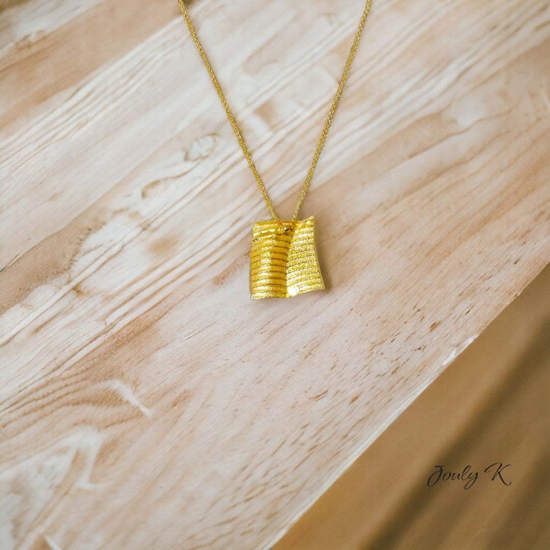 Jouly K handmade silver necklace with gold plated finish, featuring a textured square pendant.