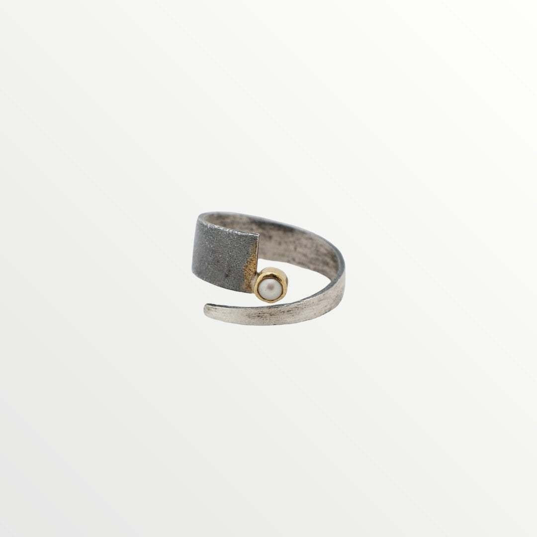 Jouly K Modern Pearl and Metal Wrap Ring with textured dark metal and silver-tone band, featuring a single lustrous pearl.