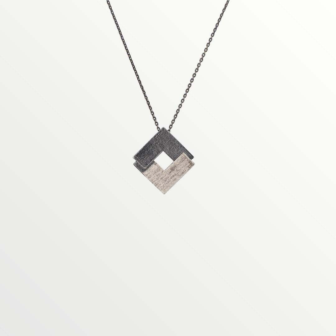 Jouly K silver 925 necklace with an oxidized finish, featuring a geometric diamond pendant with two contrasting textures.