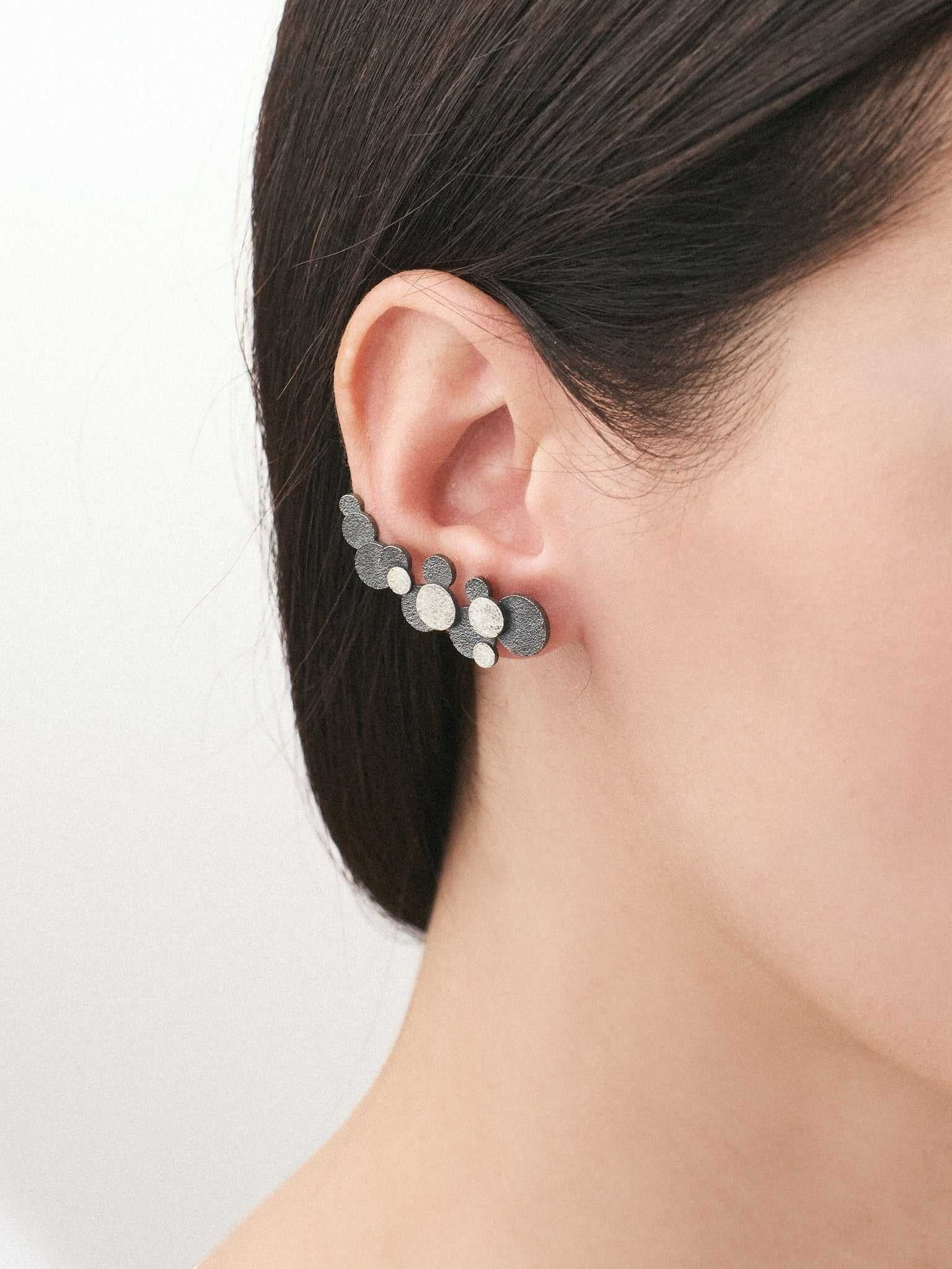 Jouly K handmade silver 925 earrings with oxidized finish and textured circles. Unique ear climbers.