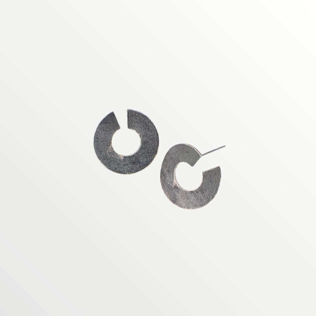Jouly K handmade silver 925 earrings with an oxidized finish, featuring a modern open hoop design.