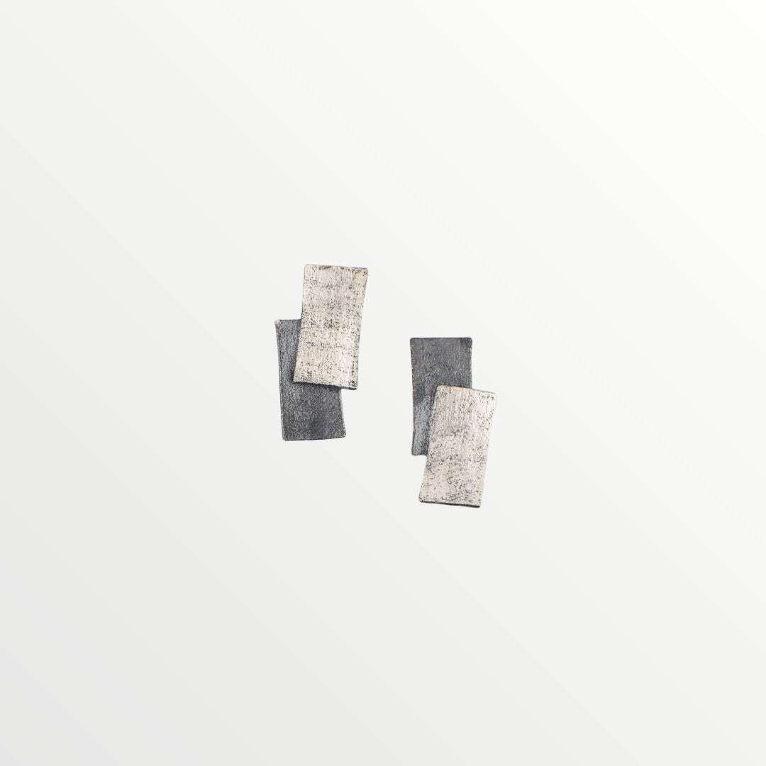 Jouly K handmade silver 925 earrings with an oxidized finish, featuring overlapping rectangular shapes.