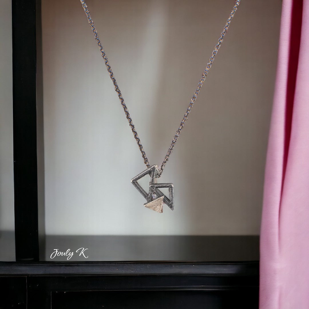 Jouly K handmade silver 925 necklace with an oxidized finish and geometric pendant. Adjustable chain length 40-45cm.
