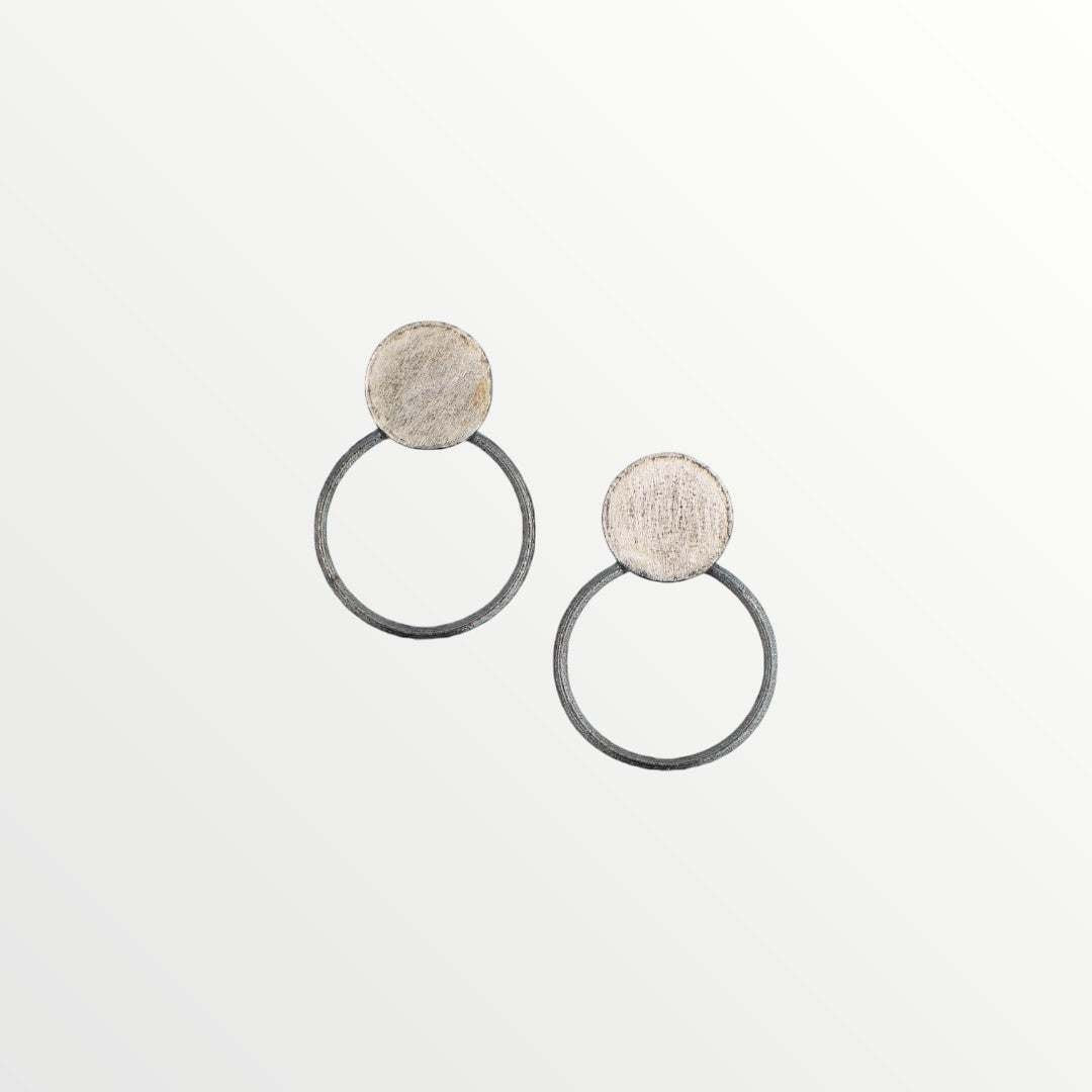 Jouly K silver hoop earrings with oxidized finish and textured circular tops.