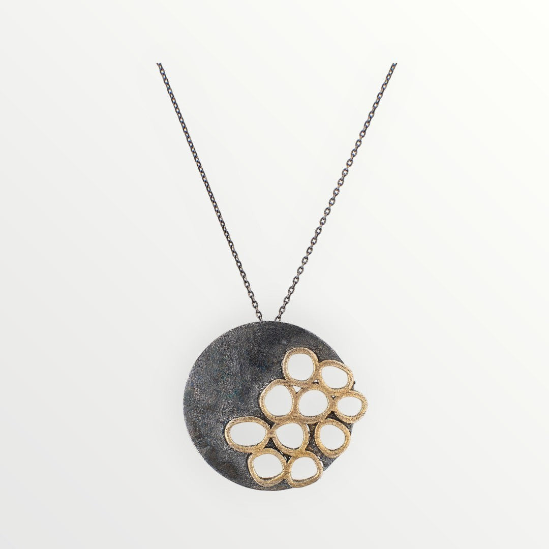 Jouly K handmade silver 925 necklace with an oxidized finish and a cluster of gold-toned open circles.