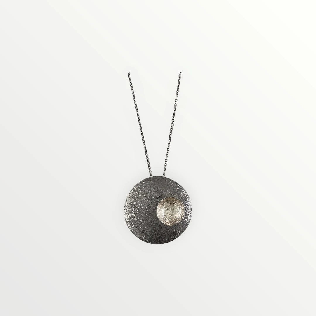 Jouly K handmade silver 925 necklace with oxidized finish and textured circular pendant with a smaller textured silver accent.