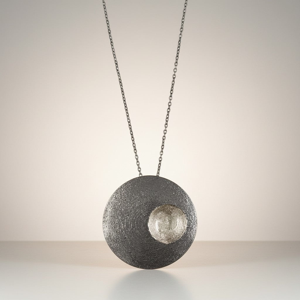 Jouly K handmade silver 925 necklace with oxidized finish and textured circular pendant.
