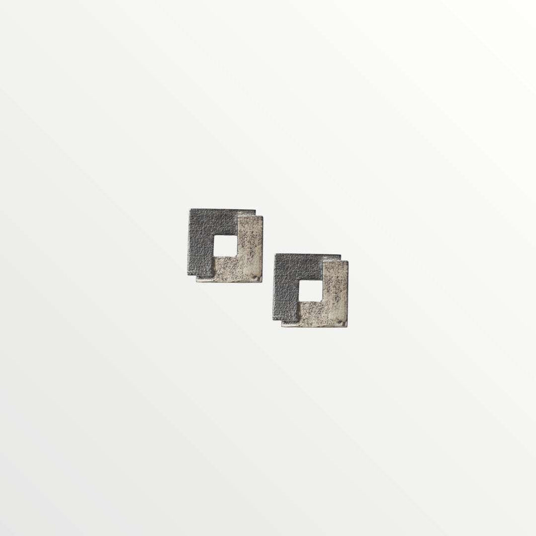 Jouly K silver 925 earrings with an oxidized finish, featuring a modern square design with a cut-out center.