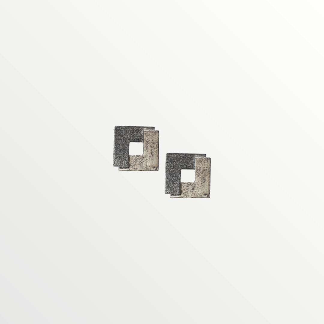 Jouly K silver 925 earrings with an oxidized finish, featuring a modern square design with a cut-out center.