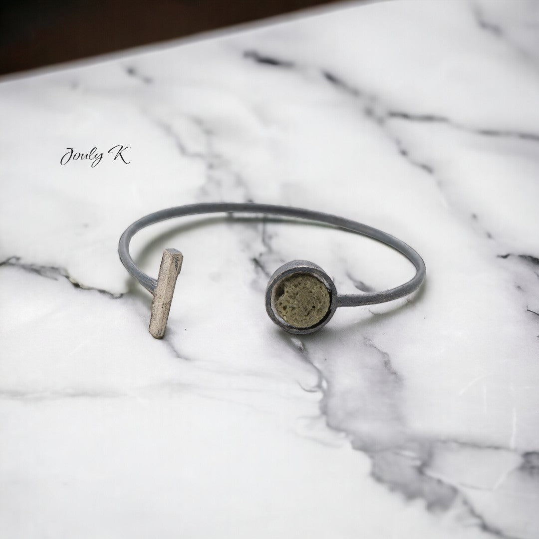 Jouly K silver 925 open bangle with oxidized finish and a round lava gemstone.