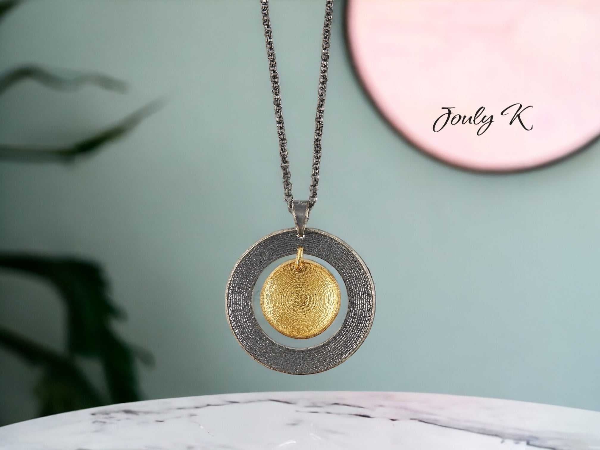 Jouly K oxidized sterling silver necklace with gold-plated textured disc pendant. Adjustable 40-45cm chain.