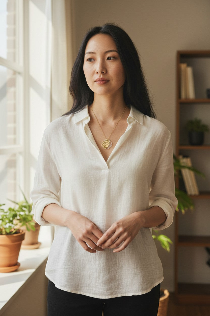 Jouly K handmade silver necklace with gold plated finish, featuring a delicate clover-shaped pendant with a honeycomb pattern.