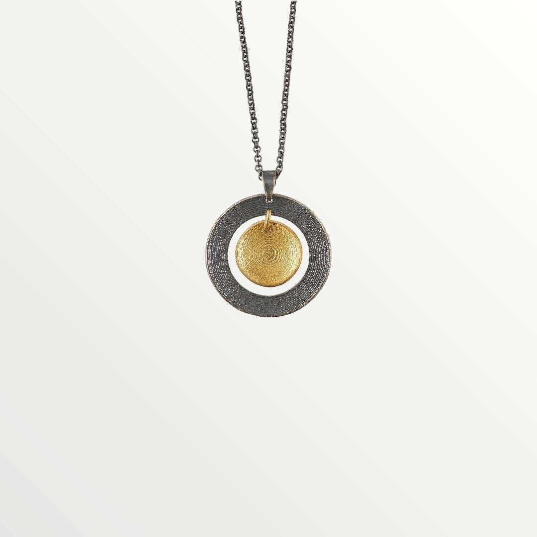 Jouly K oxidized sterling silver necklace with gold plated circular pendant and textured finish.
