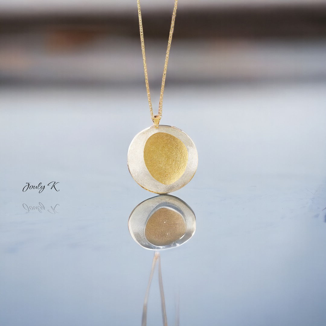 Jouly K handmade silver necklace with a textured gold plated finish. Features a circular pendant on an 80cm chain.