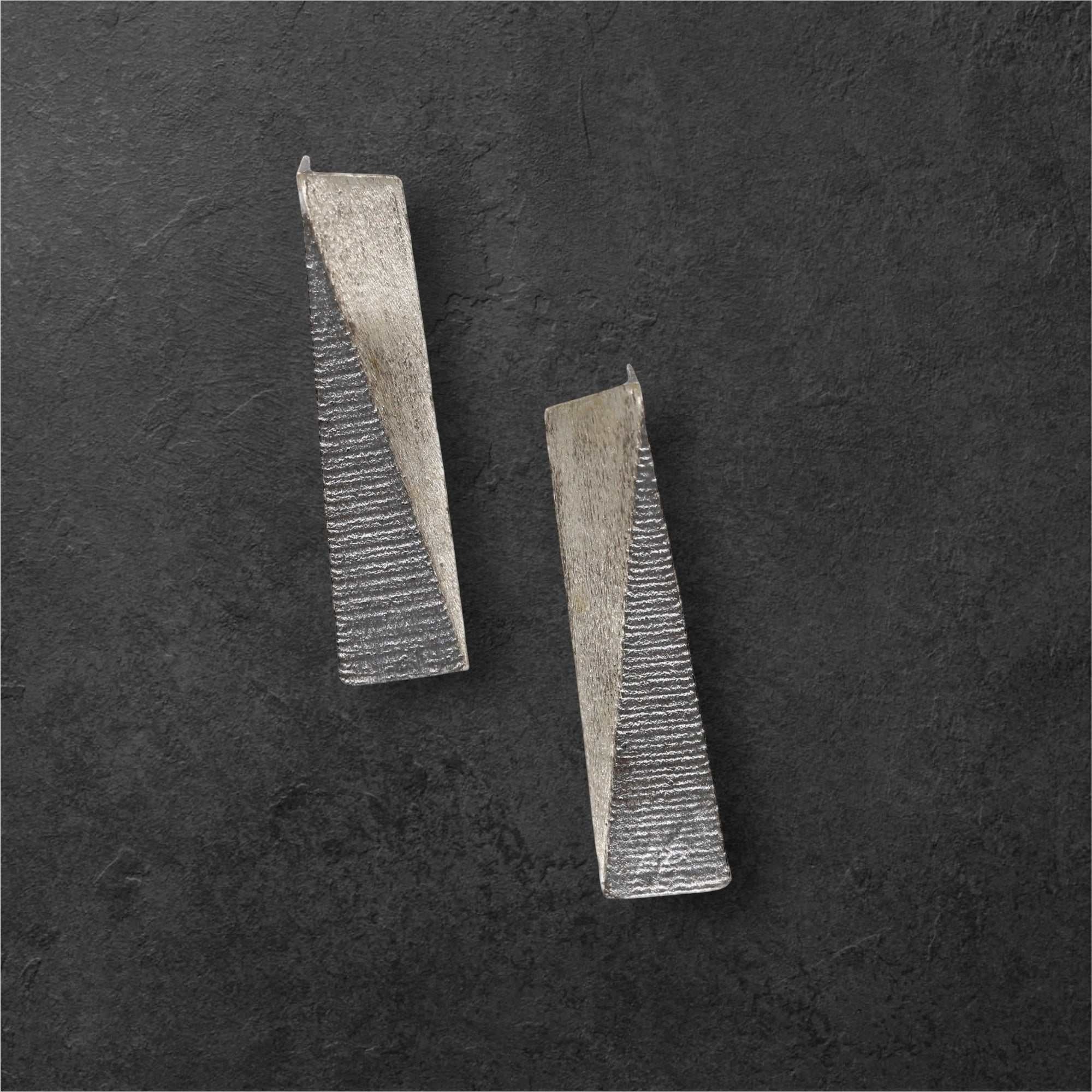 Jouly K silver 925 earrings with oxidized finish, featuring a geometric triangular design with textured detailing.
