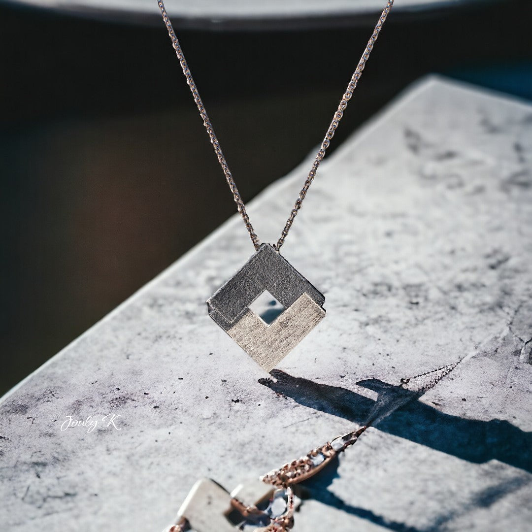 Jouly K silver necklace with oxidized finish, geometric pendant with a cutout square and vintage charm.