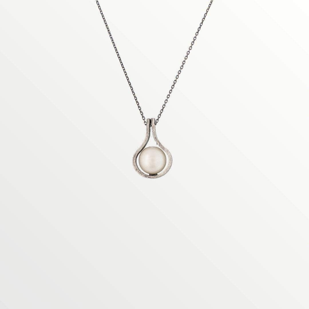Jouly K teardrop pendant necklace with a creamy white pearl in antiqued silver-tone metal.